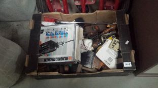 A box of tools including vice, drill etc.