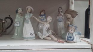 A Lladro ballerina and 6 NAO figurines including large mermaid