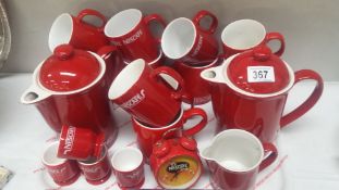 A quantity of Nescafe cups, coffee pots,