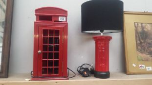 A red telephone box phone and a post box table lamp
