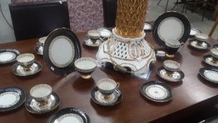 Approximately 34 pieces of a decorative tea set