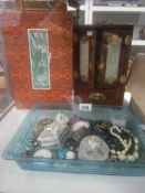 A good selection of costume jewellery including pocket watch and a Chinese laquered jewellery