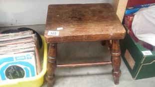 A small vintage wooden stool