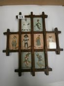 An old plus shaped frame with 8 photo/picture compartments each with an early picture of a comical