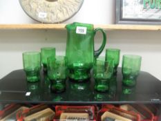 A green glass lemonade set.
