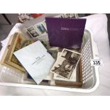 A mixed lot including cigarette cards, postcards,