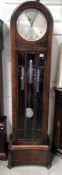 A 1930's oak Enfield Westminster chime long case clock