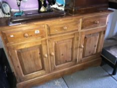 A 3 drawer 3 door sideboard