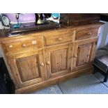 A 3 drawer 3 door sideboard