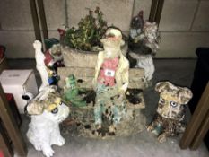 A quantity of concrete garden ornaments including gnomes, planter etc.