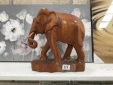 A carved teak elephant