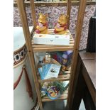 A quantity of Winnie the Pooh items including birth certificate holder, money box etc.