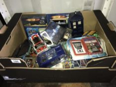 A quantity of Dr Who items including mug, books, playing cards etc.