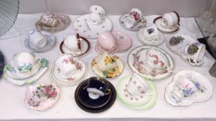 A quantity of cups and saucers including trios