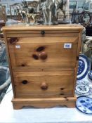 A pine bedside chest of drawers
