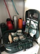 A picnic hamper and a quantity of flasks