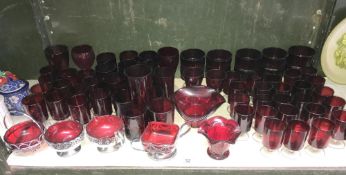 A large quantity of ruby glass drinks glasses