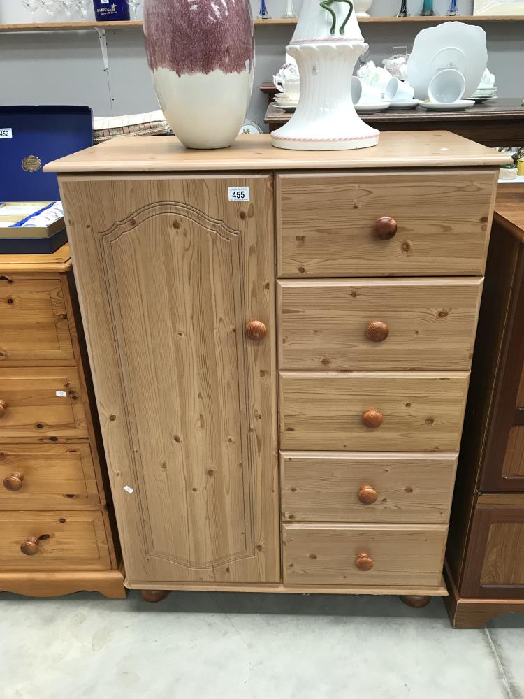 A child's pine effect combined wardrobe / chest of drawers