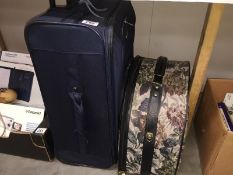 A travel bag and suitcase