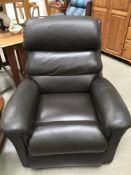 A brown leather electric recliner