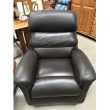 A brown leather electric recliner