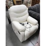 A cream electric armchair