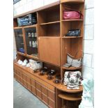 A 4 piece teak veneered wall unit