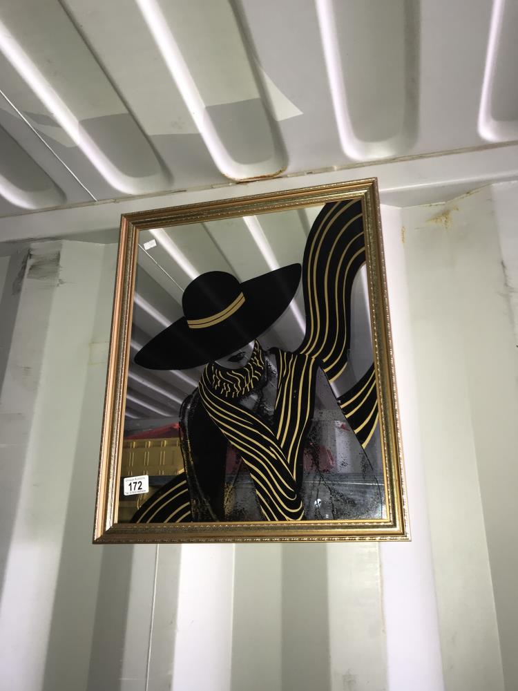 A framed mirror with lady printed on