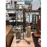 A wrought iron fire side companion set