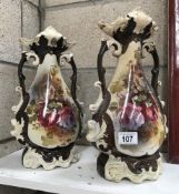 A pair of floral pottery vases