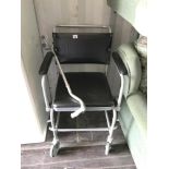 A commode on wheels and a 4 footed walking stick