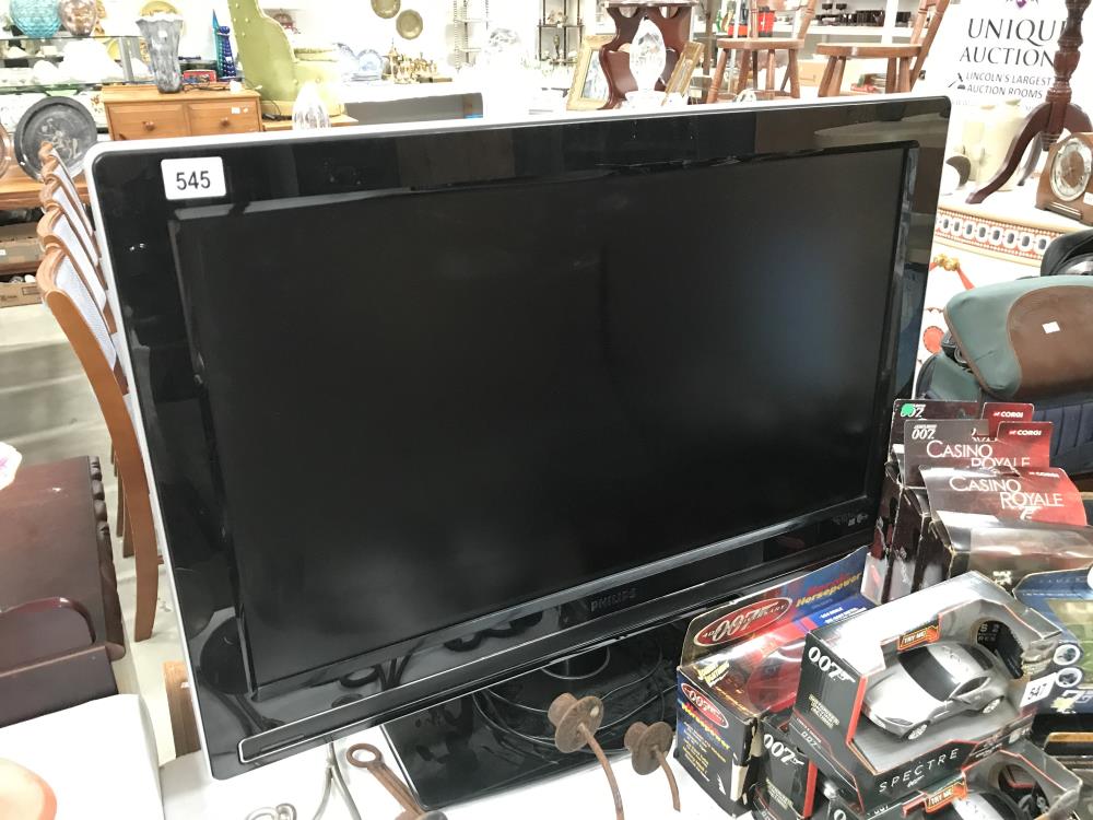 A 32" Philips flat screen TV (remote in office)