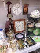 A quantity of clocks and a barometer