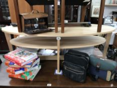 A lightwood oval coffee table