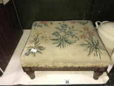 A 1930's Gregory & Co London carved oak footstool with woolwork top