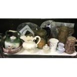 A shelf of pottery items including jugs, kettle, Rumtoft etc.