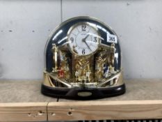 A melodies in motion clock under dome (battery operated)