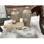 3 stoneware foot warmers and a boots bottle