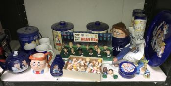 A shelf of Tetley advertising memorabilia