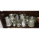 A quantity of pewter tankards