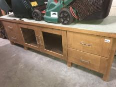 A darkwood stained low wall unit