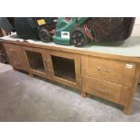 A darkwood stained low wall unit