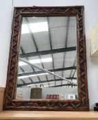 A wood/bamboo framed mirror