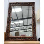 A wood/bamboo framed mirror