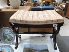 A darkwood stained dressing table stool with lyre ends