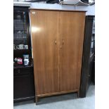 A teak effect double wardrobe