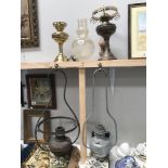 A Victorian brass hanging oil lamp and 4 others