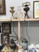A Victorian brass hanging oil lamp and 4 others