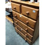 A modern solid pine chest of drawers