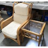 A bamboo conservatory chair and glass top table